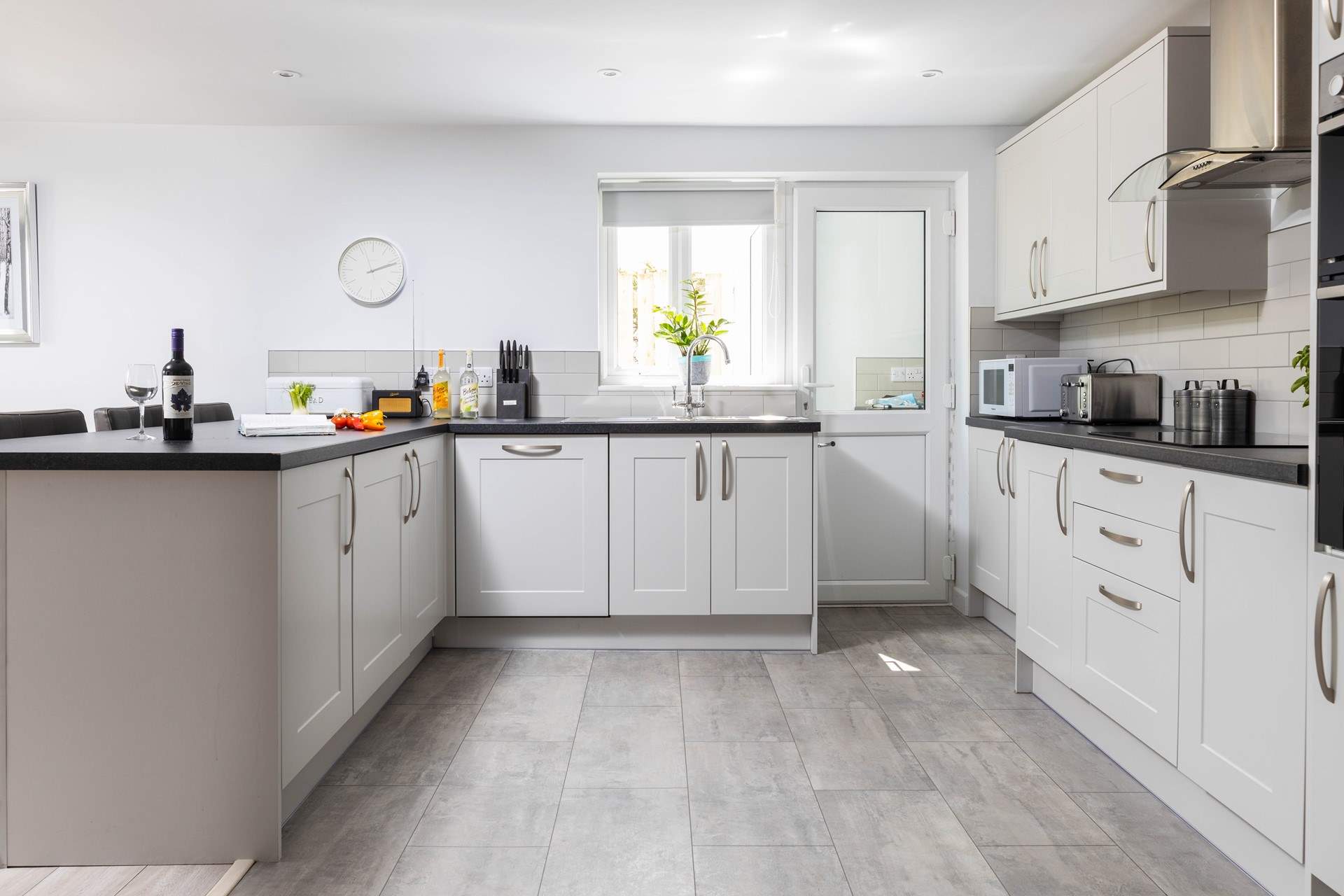 The stylish kitchen has all you need to create a culinary delight.