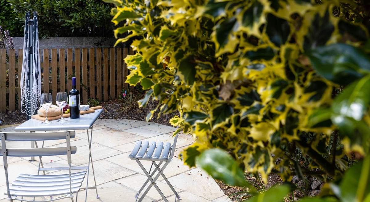 There's a secluded patio at the rear of The Wickets with a bistro table and chairs.