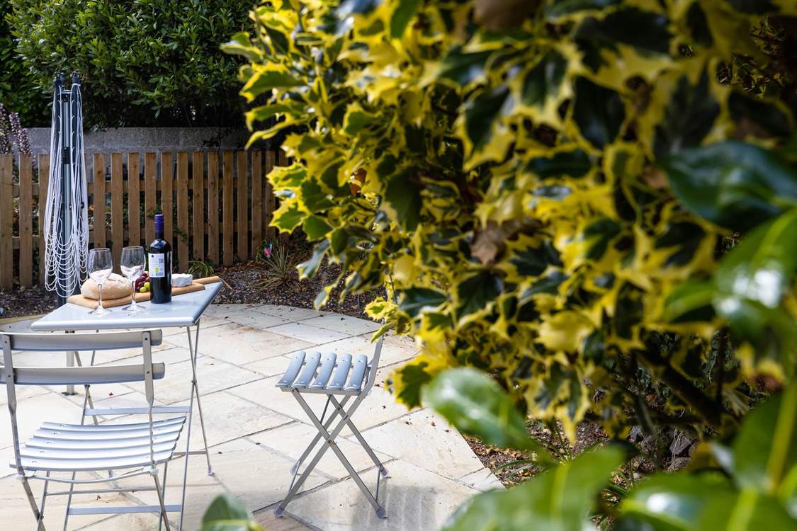 There's a secluded patio at the rear of The Wickets with a bistro table and chairs.