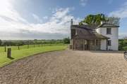There is ample parking at the rear of the house for four cars.