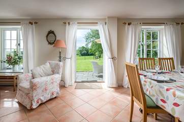 A back door leads from the open plan sitting/dining-room to the excellent garden.
