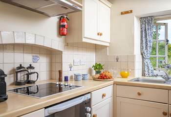 The homely kitchen has everything you'll need.