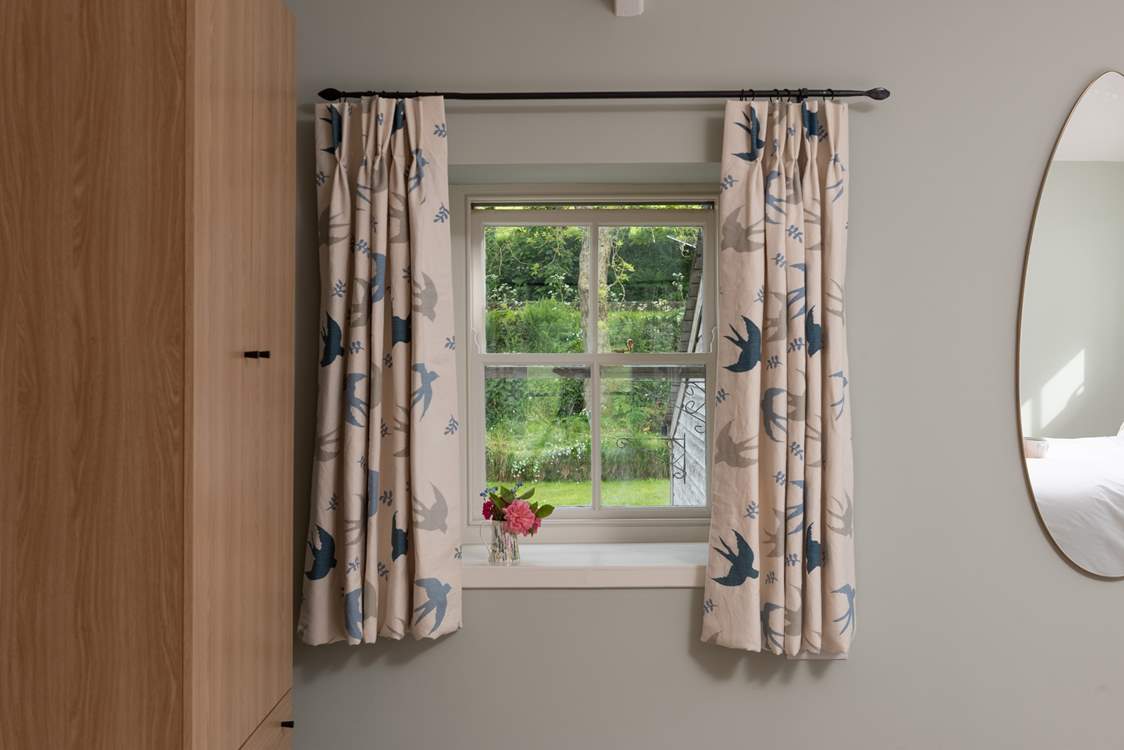 Let the crisp natural light creep in through the charming windows.