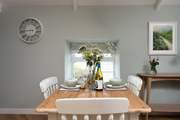 The gorgeous dining-table is excellent for hearty dinners.
