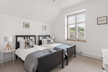 Bedroom 2 is a cute room with twin beds.
