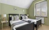 Bedroom 2 is a cute room with twin beds. - Thumbnail Image