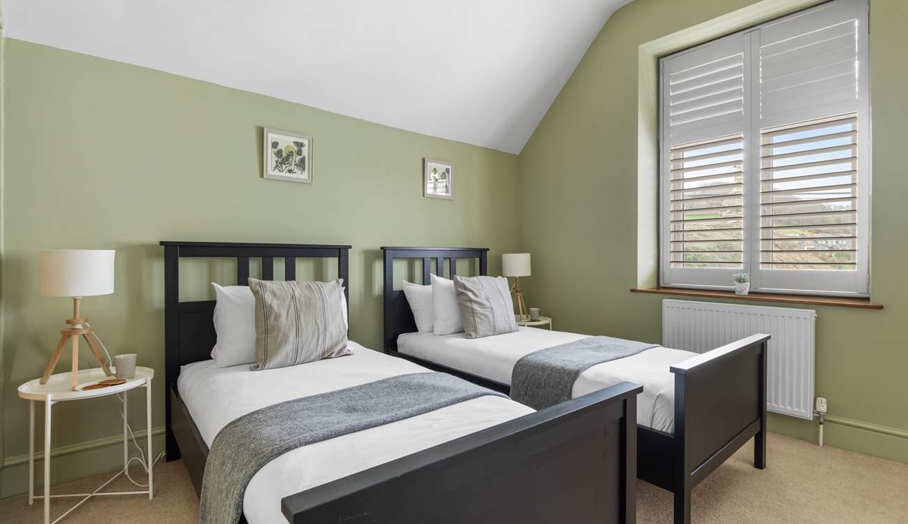 Bedroom 2 is a cute room with twin beds.