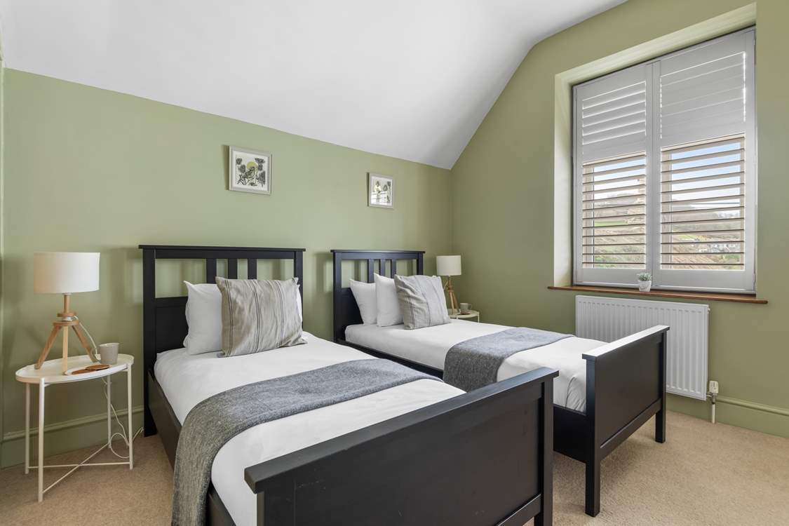 Bedroom 2 is a cute room with twin beds.