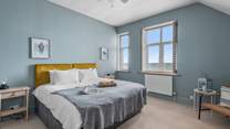 Bedroom 1 is stylish double room with a king-size bed (and a fabulous sea view!).