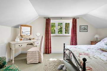The pretty double bedroom has a gorgeous outlook.