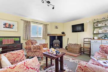 The ground floor is open plan with a cosy and welcoming sitting-area.