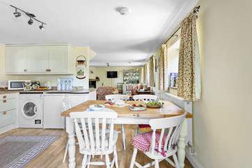 The farmhouse table is the perfect place to gather everyone for a sociable meal.