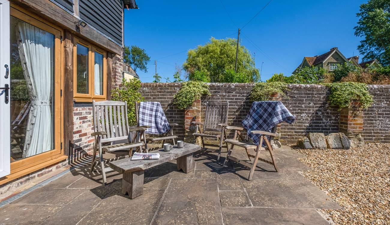 Relax with a coffee and the morning papers on the patio.