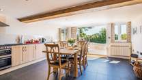 The spacious and sociable kitchen has bi-folding doors that open onto the patio and courtyard.