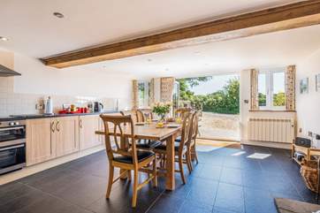 The spacious and sociable kitchen has bi-folding doors that open onto the patio and courtyard.