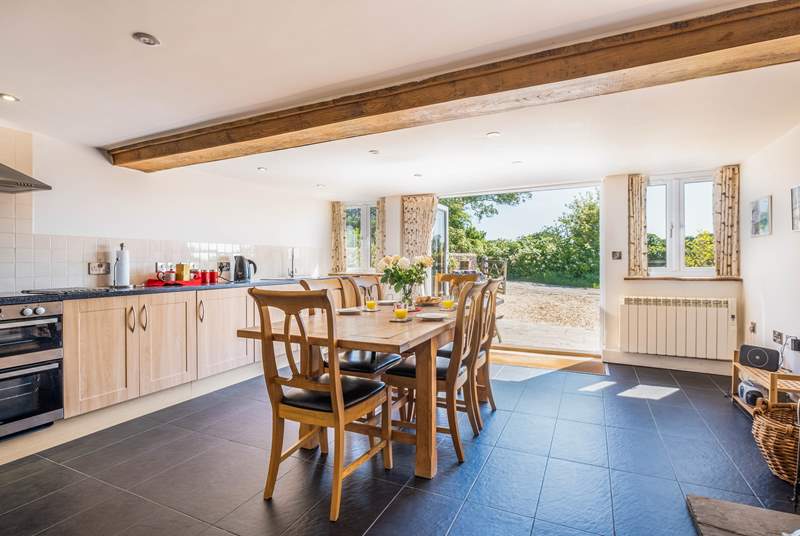 The spacious and sociable kitchen has bi-folding doors that open onto the patio and courtyard.