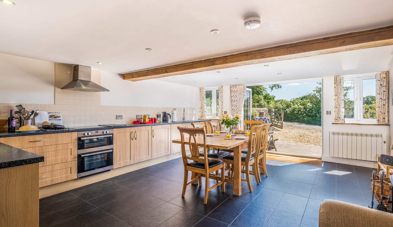 The kitchen/dining area is so light and airy.