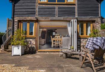 Large bi-folding doors lead into an open plan living area.