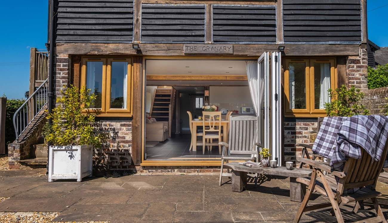 Large bi-folding doors lead into an open plan living area.