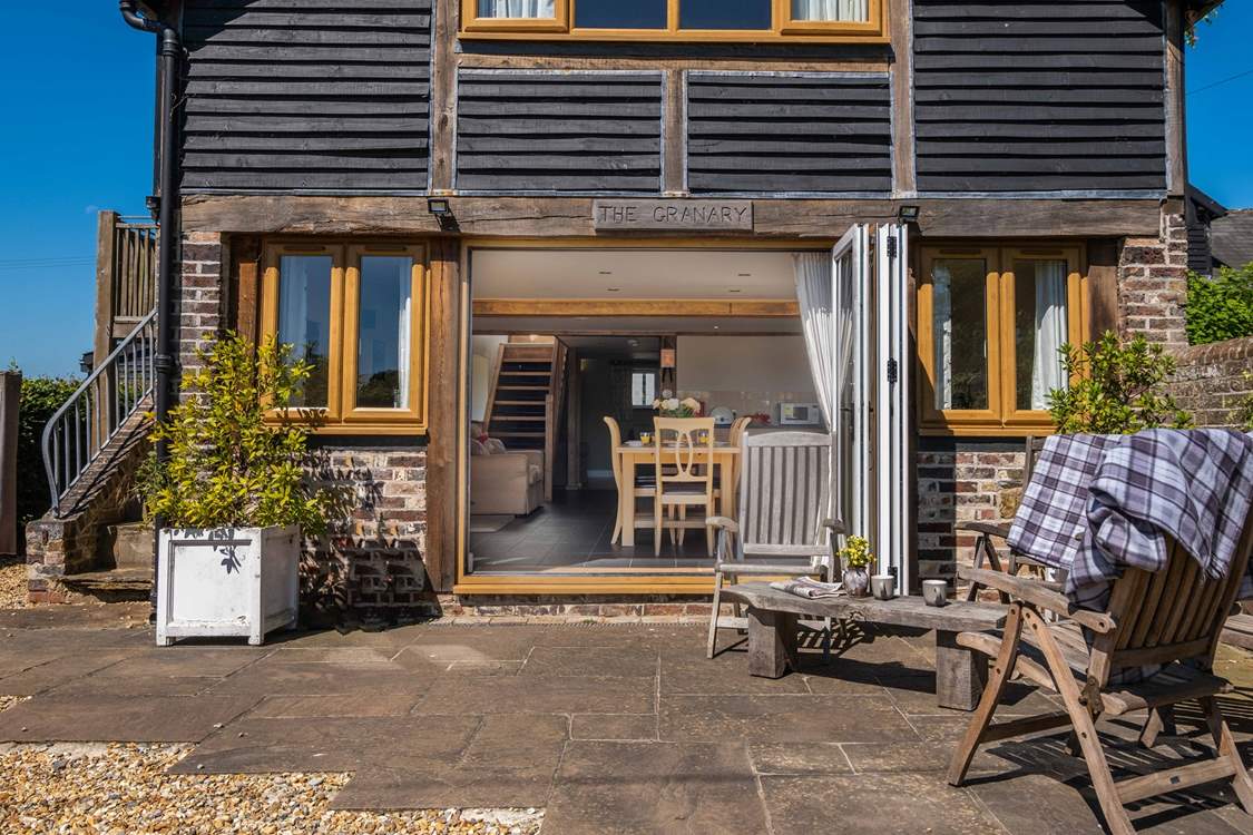 Large bi-folding doors lead into an open plan living area.