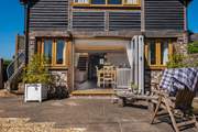 Large bi-folding doors lead into an open plan living area.