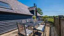 Take in the countryside views from the balcony -  the perfect place for al fresco dining.