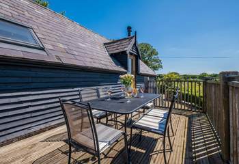 Take in the countryside views from the balcony -  the perfect place for al fresco dining.