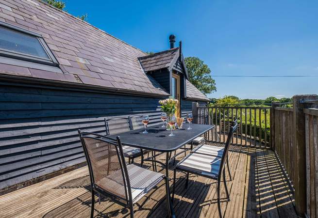 Take in the countryside views from the balcony -  the perfect place for al fresco dining.