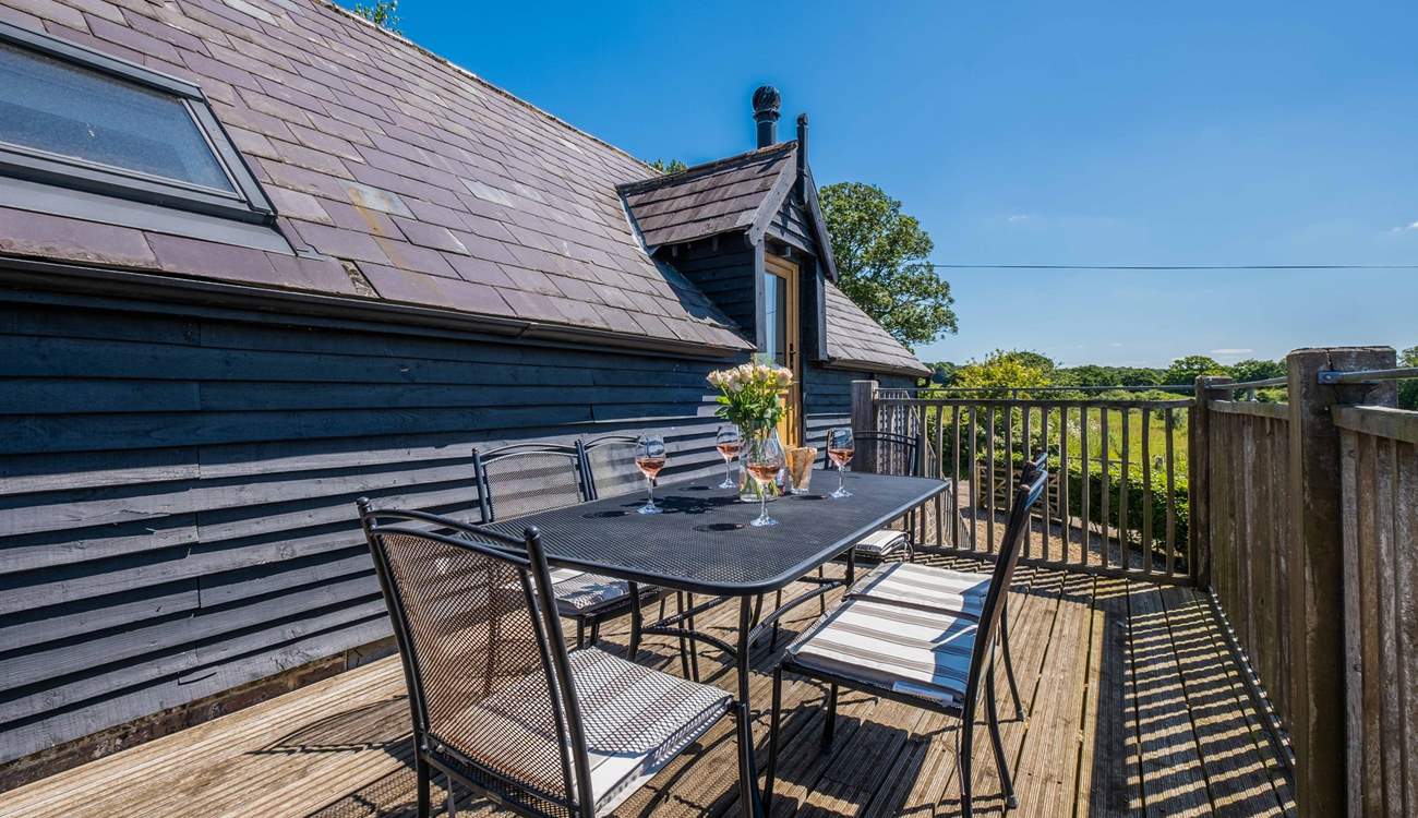 Take in the countryside views from the balcony -  the perfect place for al fresco dining.