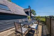 Take in the countryside views from the balcony -  the perfect place for al fresco dining.