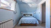 A door leads to the en suite shower-room.