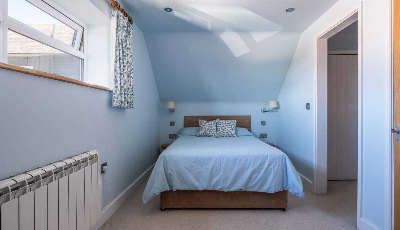 A door leads to the en suite shower-room.