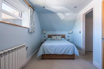 A door leads to the en suite shower-room.
