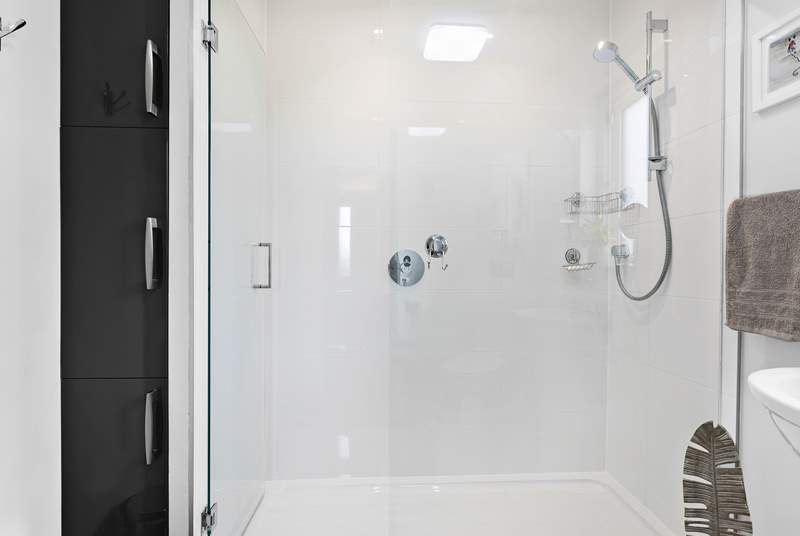 Refresh yourself after a long day at the beach in the modern shower.