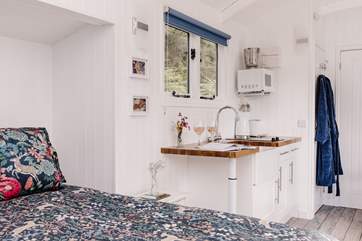 The cute kitchen is superbly equipped with everything you'll need.