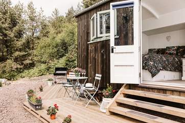 Vibrant flowers complete the gorgeous outside space.