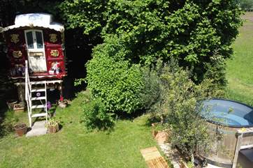 The fabulous hot tub can be found next to the wagon.