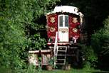 A snug cabin and an original, 100-year-old, Showman's wagon are available to hop between during the summer months. 