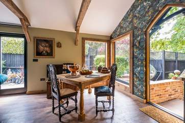 Plenty of natural light shines through the large windows and doors.