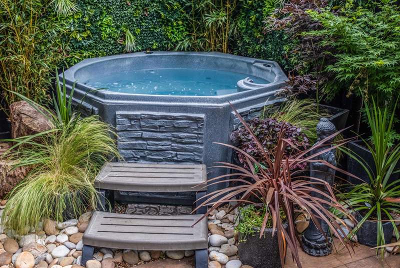 Your own private hot tub is nestled in a sub-tropical paradise.