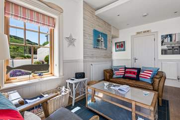 The open plan living space has a quirky nautical theme throughout.