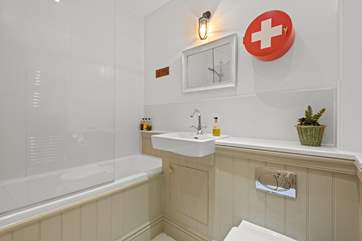 The family bathroom has a shower and a bath, perfect for a long soak after a busy day.