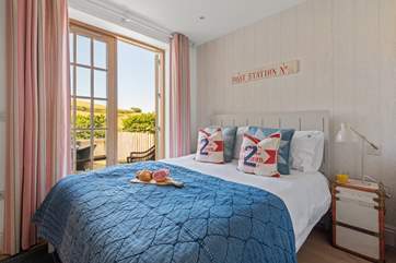 The lovely double room has a king-size bed and doors leading out to the patio.
