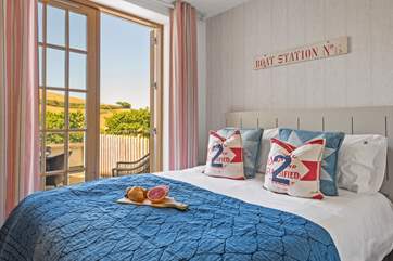 The double bedroom has a super comfy king-size bed and access to the private terrace for your morning cuppa.