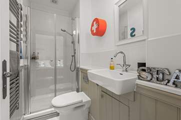 The double bedroom has an en suite shower-room, perfect for washing salty toes.