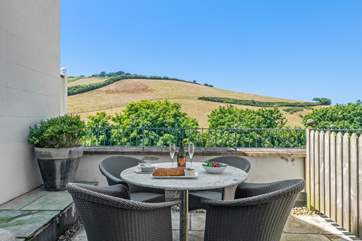 The private rear patio has gorgeous views over the surrounding Devonshire countryside.