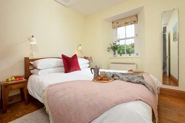 The pretty double bedroom has a king-size bed.