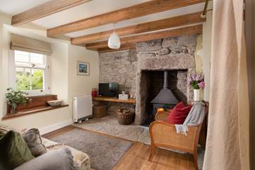 The characterful sitting-room is warm and welcoming.