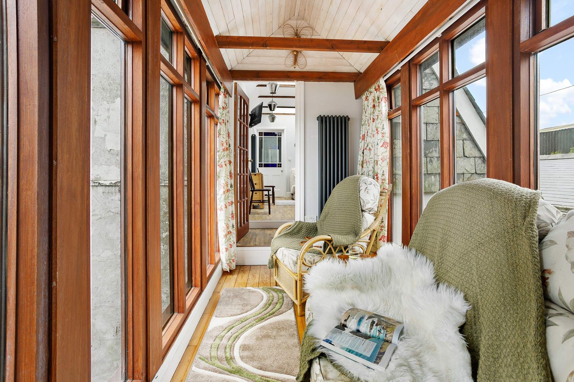 The walkway extends from the living area, down two steps, a great place to sit and enjoy a good holiday read.