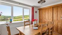 Enjoy delicious meals at the homely dinner table.
